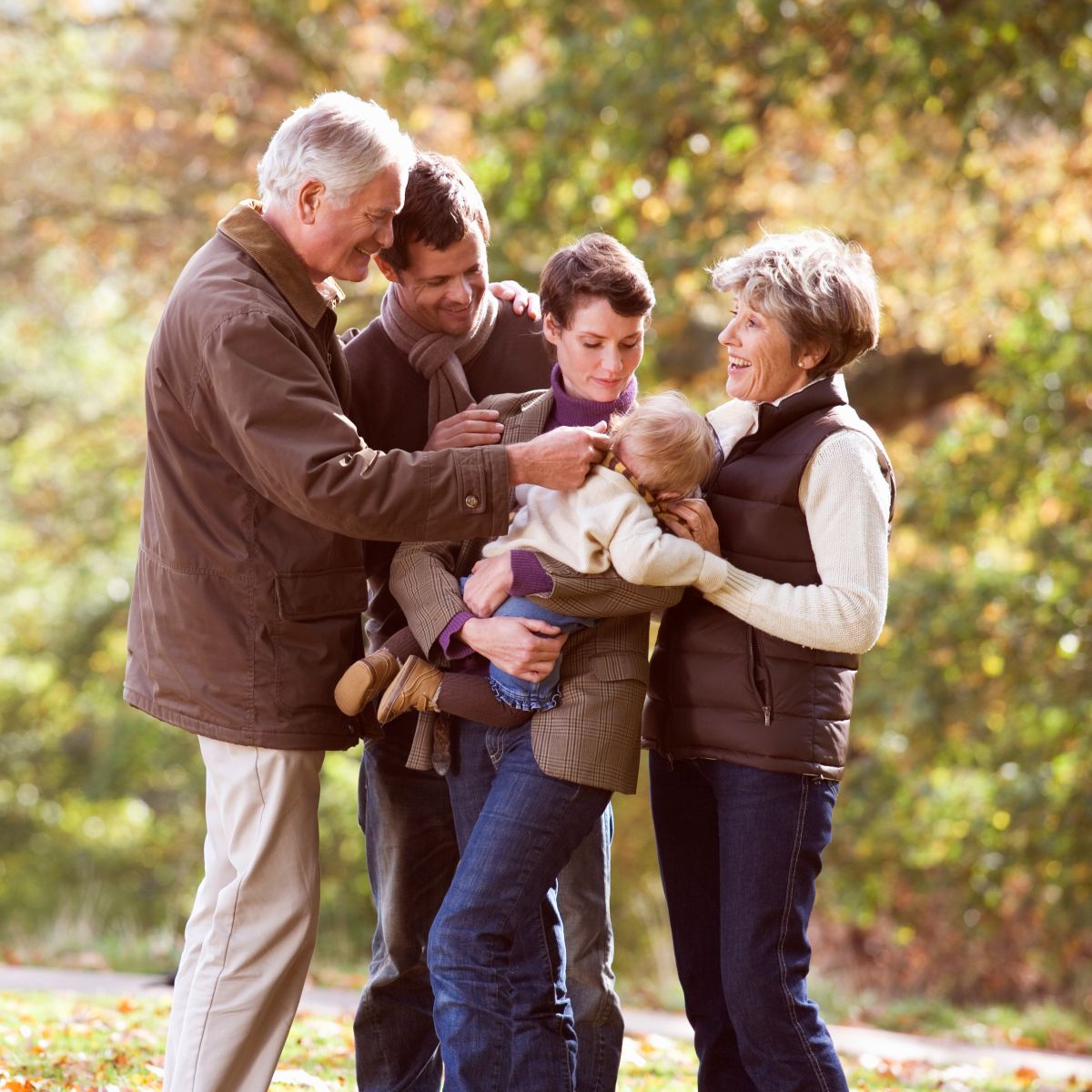Happy multigenerational family in the park, representing life after PAMO treatment