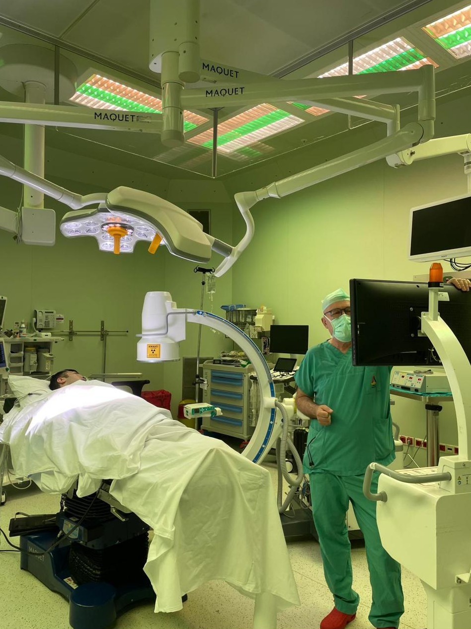 Operating room environment with real-time C-arm imaging guidance used for the PAMO procedure